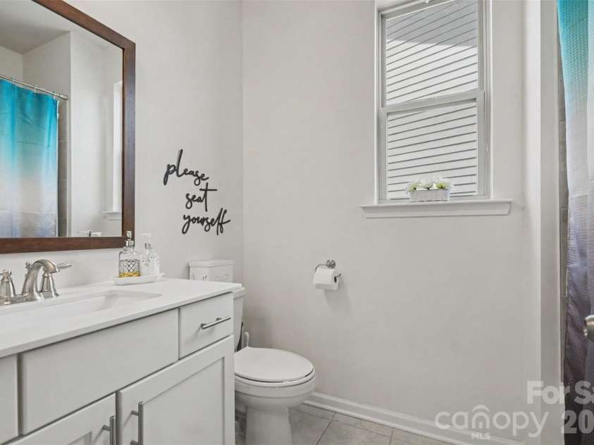 2055 Yearden Lane, Monroe, NC 28110.  MLS# CAR4397294, YatesRealty ID 37922. Full bath downstairs has solid counters and a bath/shower combination.