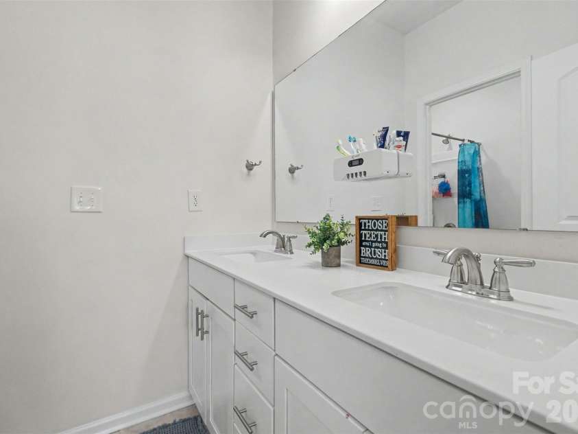 2055 Yearden Lane, Monroe, NC 28110.  MLS# CAR4397294, YatesRealty ID 37922. The second bathroom features a solid dual vanity with lots of drawers and cabinets.