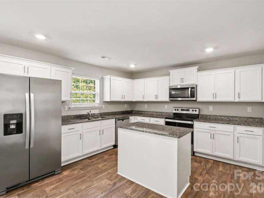 310 Kingsford Drive, Stanley, NC 28164.  MLS# CAR4400766, YatesRealty ID 37928. Kitchen with island