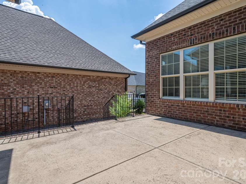 5247 Courtyard Lane, Belmont, NC 28012.  MLS# CAR4404937, YatesRealty ID 37931. Back patio - perfect for entertaining!