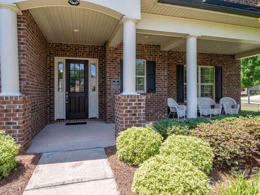 5247 Courtyard Lane, Belmont, NC 28012.  MLS# CAR4404937, YatesRealty ID 37931. Covered front porch.