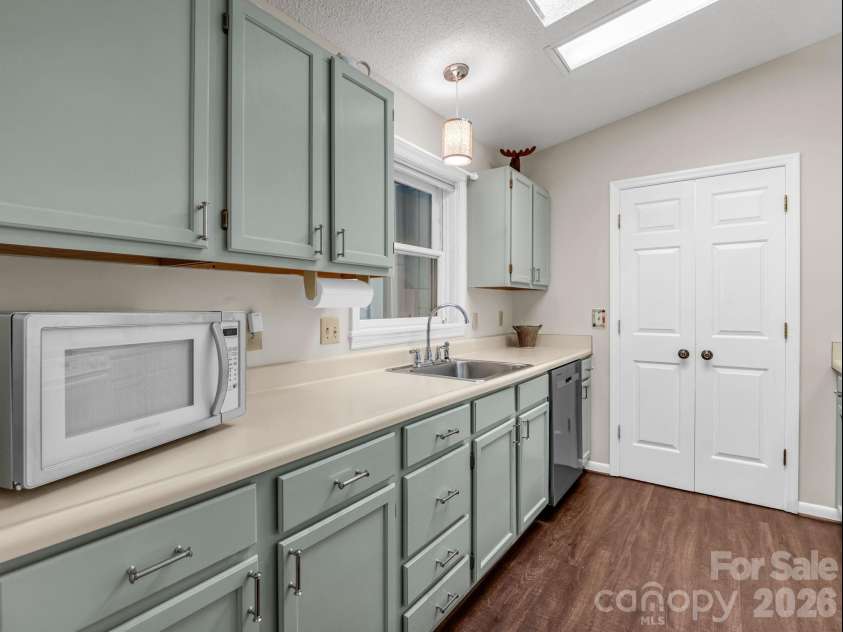251 Carolina Drive, Tryon, NC 28782.  MLS# CAR4405426, YatesRealty ID 37939. Kitchen with pantry
