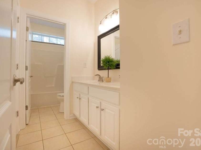 147 Honeysuckle Creek Loop, Mooresville, NC 28117.  MLS# CAR4368793, YatesRealty ID 37940. Bathroom 2 w/Double Vanity on Main Level