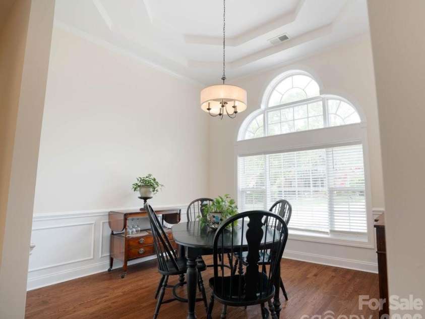 147 Honeysuckle Creek Loop, Mooresville, NC 28117.  MLS# CAR4368793, YatesRealty ID 37940. Dining Room accented w/ Soaring Tray Ceilings