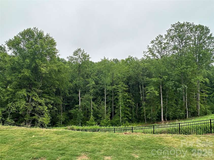 1261 Jenna Lynn Court, Lowell, NC 28098.  MLS# CAR4387224, YatesRealty ID 37941. Direct View from Backyard