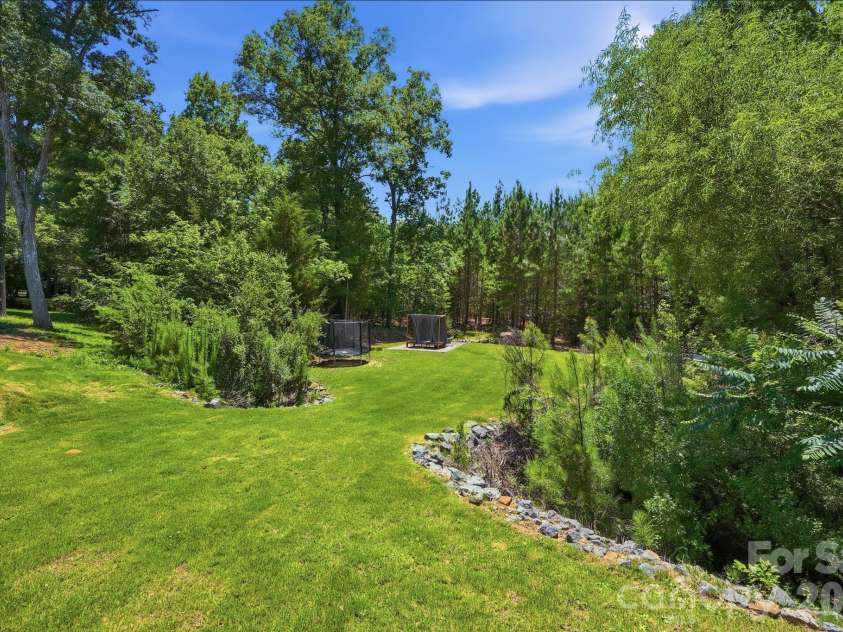 4870 Summerside Drive, Clover, SC 29710.  MLS# CAR4394846, YatesRealty ID 37943. Expansive backyard