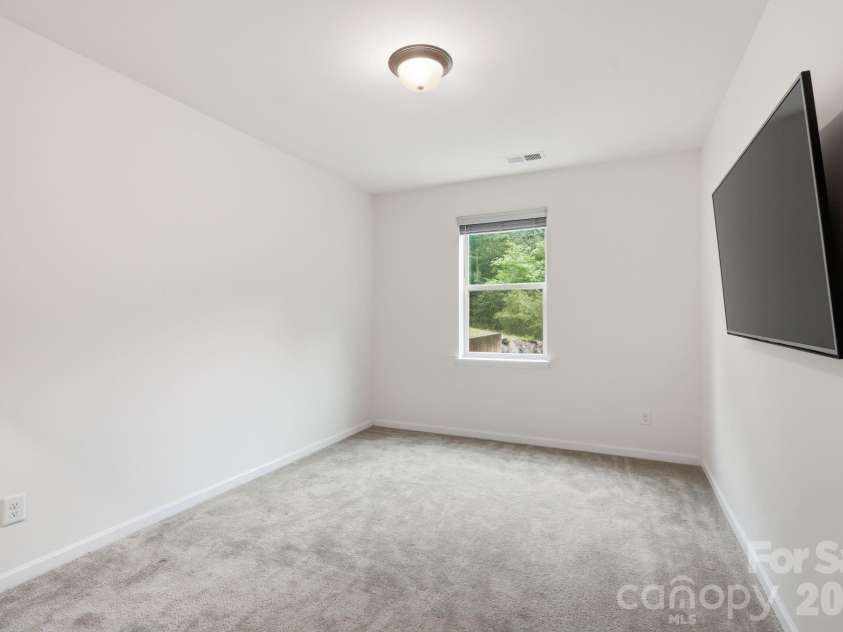 4870 Summerside Drive, Clover, SC 29710.  MLS# CAR4394846, YatesRealty ID 37943. Walkout basement bedroom