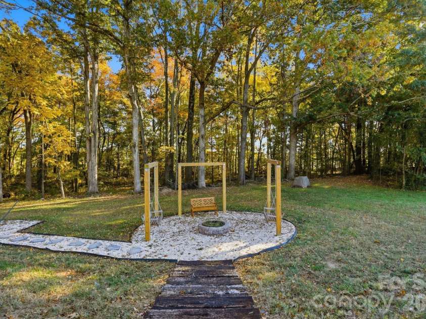 4105 Parkwood School Road, Monroe, NC 28112.  MLS# CAR4402329, YatesRealty ID 37950. Custom Built Fire Pit and Swing/Hammock Area