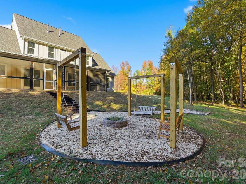 4105 Parkwood School Road, Monroe, NC 28112.  MLS# CAR4402329, YatesRealty ID 37950. Custom Built Fire Pit and Swing/Hammock Area