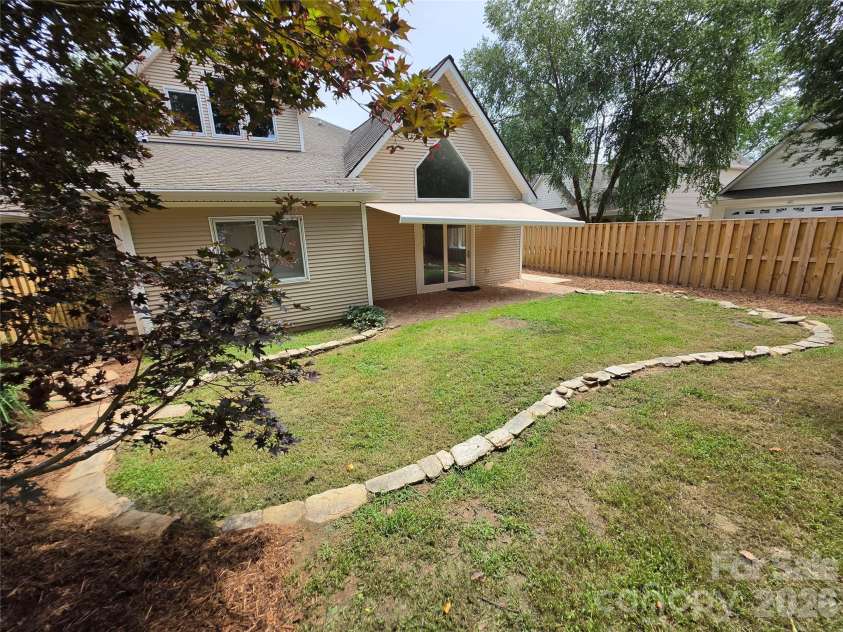 41 Beekeeper Trail, Swannanoa, NC 28778.  MLS# CAR4402946, YatesRealty ID 37962. Back yard, patio, power awning extended.