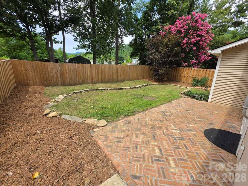 41 Beekeeper Trail, Swannanoa, NC 28778.  MLS# CAR4402946, YatesRealty ID 37962. Back yard, patio, power awning retracted.