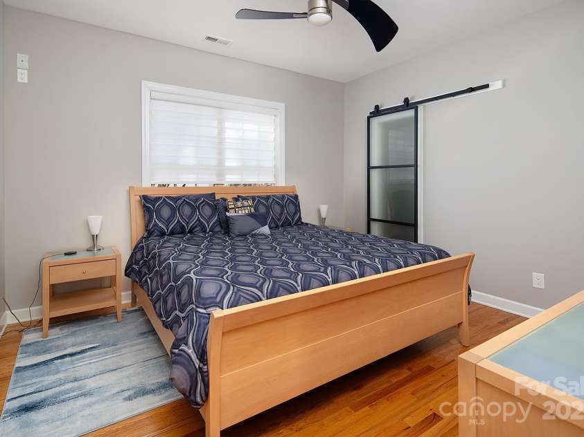4706 Gold Finch Drive, Denver, NC 28037.  MLS# CAR4237582, YatesRealty ID 3797. Bedroom #2 with Closet System and Glass Paneled Barn Door, Hardwood Floors
