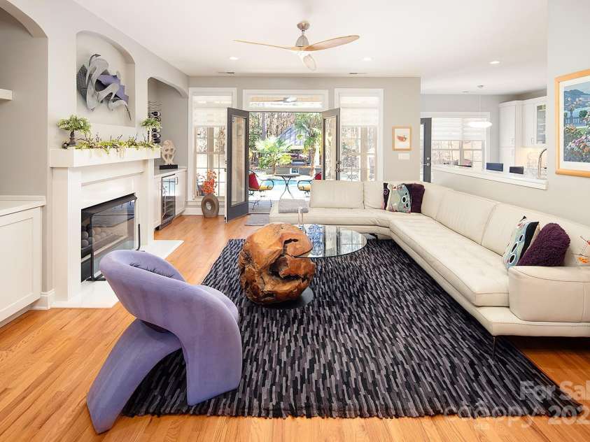 4706 Gold Finch Drive, Denver, NC 28037.  MLS# CAR4237582, YatesRealty ID 3797. Great Room with fireplace and doors leading to amazing outdoor entertainment space!