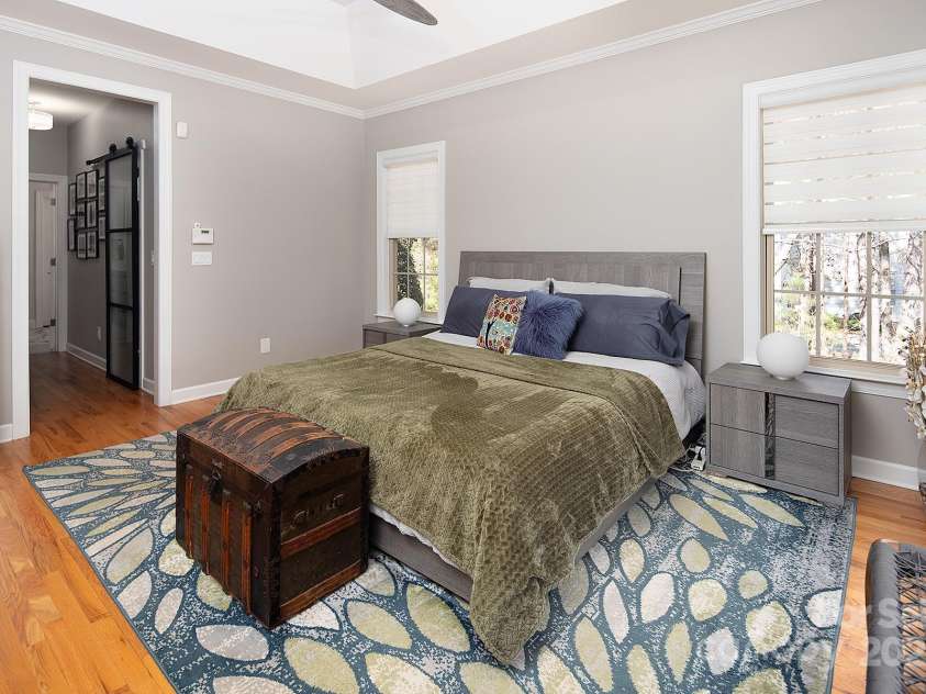 4706 Gold Finch Drive, Denver, NC 28037.  MLS# CAR4237582, YatesRealty ID 3797. Primary Bedroom Closets have Closet Systems with Glass Paneled Barn Doors