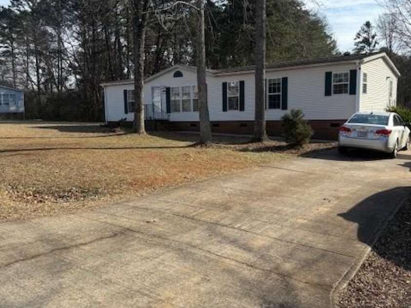 127 Knight N Gail Drive, Mooresville, NC 28115.  MLS# CAR4341014, YatesRealty ID 3799. Concrete Driveway parks several cars 