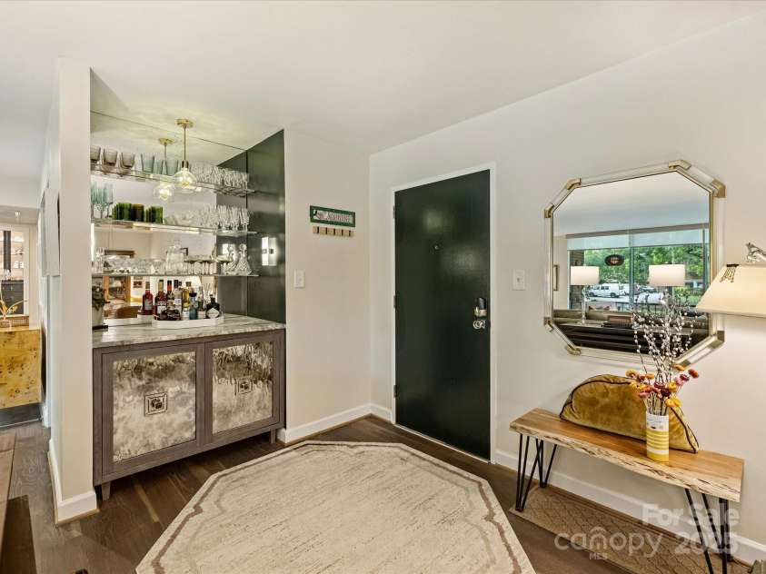 1300 Queens Road, Charlotte, NC 28207.  MLS# CAR4283635, YatesRealty ID 3800. Custom Bar, Antique Glass and Leathered Granite Top