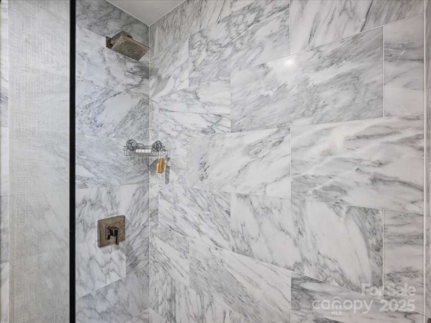 1300 Queens Road, Charlotte, NC 28207.  MLS# CAR4283635, YatesRealty ID 3800. Hall Bath Marble Shower