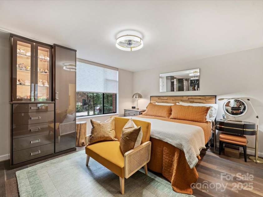 1300 Queens Road, Charlotte, NC 28207.  MLS# CAR4283635, YatesRealty ID 3800. Primary Bedroom with Custom Lighted Cabinetry, Decorative Light/Fan, Remote Shade