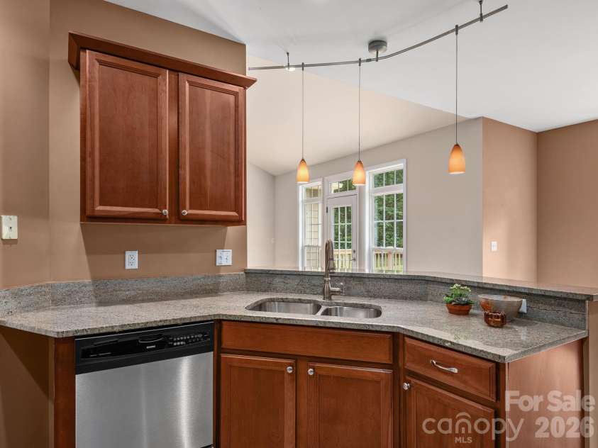509 Shamrock Drive, Asheville, NC 28803.  MLS# CAR4402725, YatesRealty ID 38014. Kitchen view out