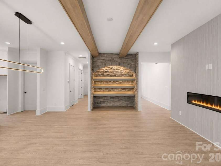 9420 Greyson Ridge Drive, Charlotte, NC 28277.  MLS# CAR4405364, YatesRealty ID 38024. Stone Wall with (Wine) Shelves