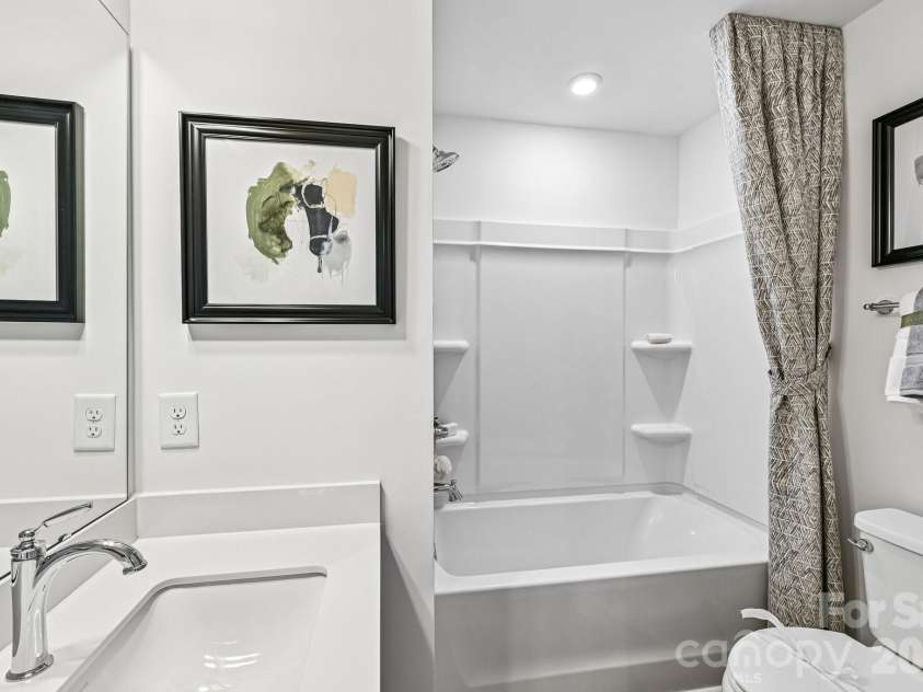 7567 Ethora Way, Charlotte, NC 28216.  MLS# CAR4392026, YatesRealty ID 38028. Model Home - Guest Bath 2.