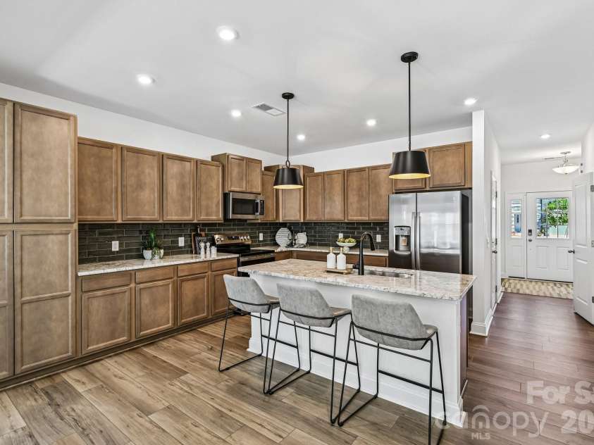 7567 Ethora Way, Charlotte, NC 28216.  MLS# CAR4392026, YatesRealty ID 38028. Model Home - Kitchen.