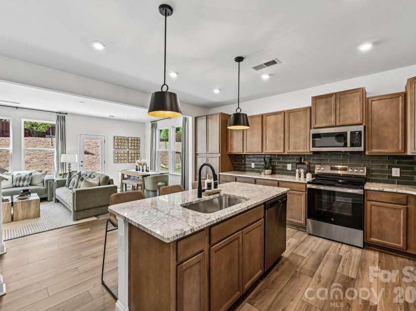 7567 Ethora Way, Charlotte, NC 28216.  MLS# CAR4392026, YatesRealty ID 38028. Model Home - Open Floor Plan, Living, Kitchen & Dining Area.