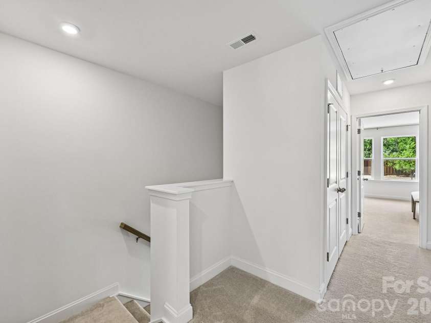 7567 Ethora Way, Charlotte, NC 28216.  MLS# CAR4392026, YatesRealty ID 38028. Model Home - Second Floor Hallway, Split Bedrom Layout.