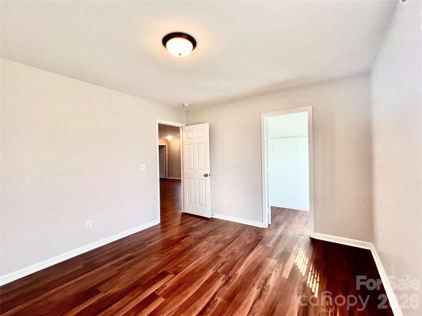 2021 Blue Stream Lane, Indian Trail, NC 28079.  MLS# CAR4379925, YatesRealty ID 38034. Front secondary Bedroom. Large Walk-in closet