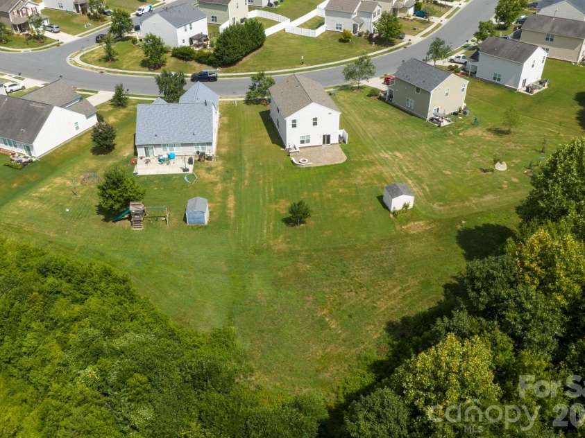 2021 Blue Stream Lane, Indian Trail, NC 28079.  MLS# CAR4379925, YatesRealty ID 38034. HOA maintained space, in front and behind!