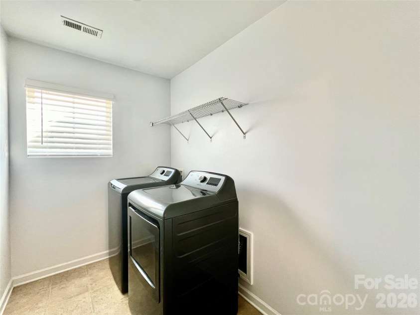 2021 Blue Stream Lane, Indian Trail, NC 28079.  MLS# CAR4379925, YatesRealty ID 38034. Large Laundry Room, upper level