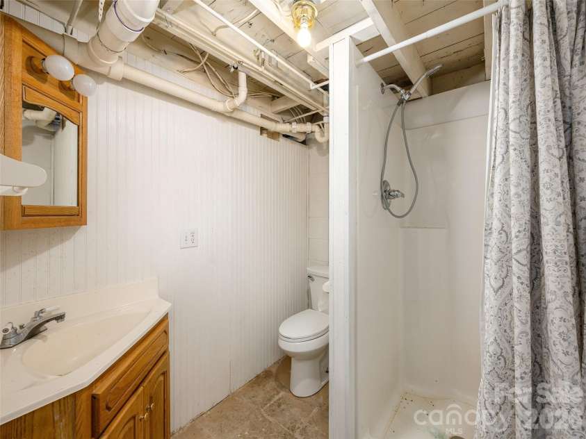340 Mauney Cove, Waynesville, NC 28786.  MLS# CAR4401250, YatesRealty ID 38064. Full bath with shower in basement
