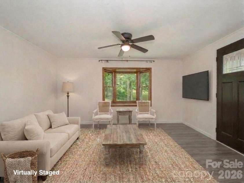 340 Mauney Cove, Waynesville, NC 28786.  MLS# CAR4401250, YatesRealty ID 38064. Virtually staged living room