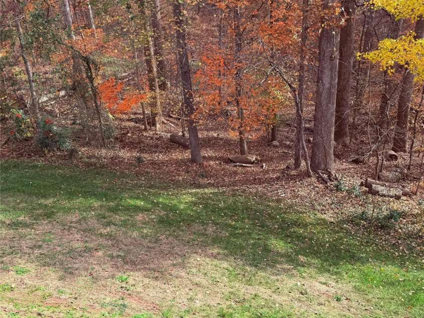 11620 Foggy Bank Lane, Charlotte, NC 28214.  MLS# CAR4204252, YatesRealty ID 3807. Wooded backyard