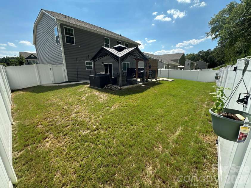 243 Autumn Sage Drive, Locust, NC 28097.  MLS# CAR4402759, YatesRealty ID 38105. Backyard