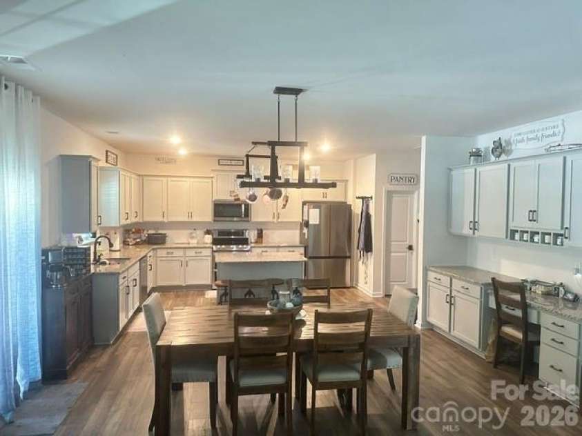 243 Autumn Sage Drive, Locust, NC 28097.  MLS# CAR4402759, YatesRealty ID 38105. Dining Room looking into kitchen