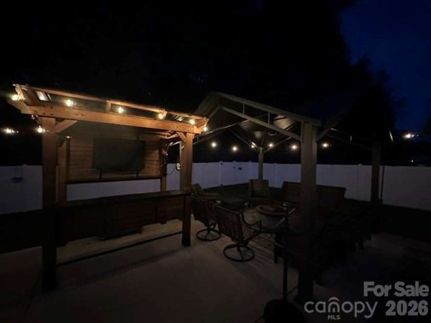 243 Autumn Sage Drive, Locust, NC 28097.  MLS# CAR4402759, YatesRealty ID 38105. Patio with lights