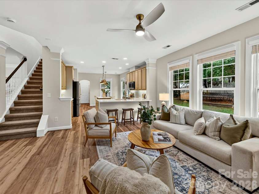 8707 Lake Pines Drive, Cornelius, NC 28031.  MLS# CAR4402781, YatesRealty ID 38115. Bright and inviting Great Room features a contemporary fireplace, expansive windows overlooking the backyard, and an open layout designed for comfortable living and effortless entertaining.