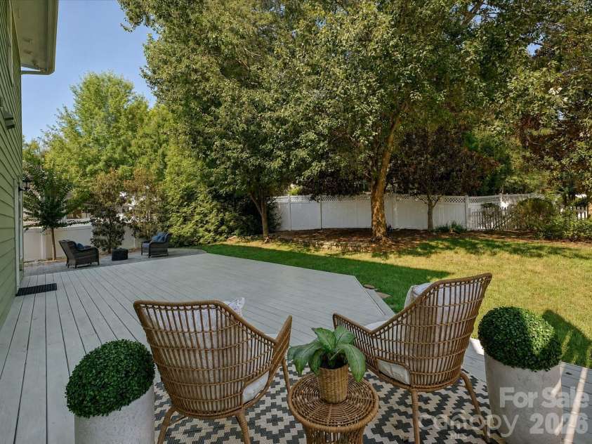 8707 Lake Pines Drive, Cornelius, NC 28031.  MLS# CAR4402781, YatesRealty ID 38115. Expansive deck overlooks the private, fenced backyard, creating the perfect setting for outdoor dining, entertaining, or relaxing in a peaceful setting.