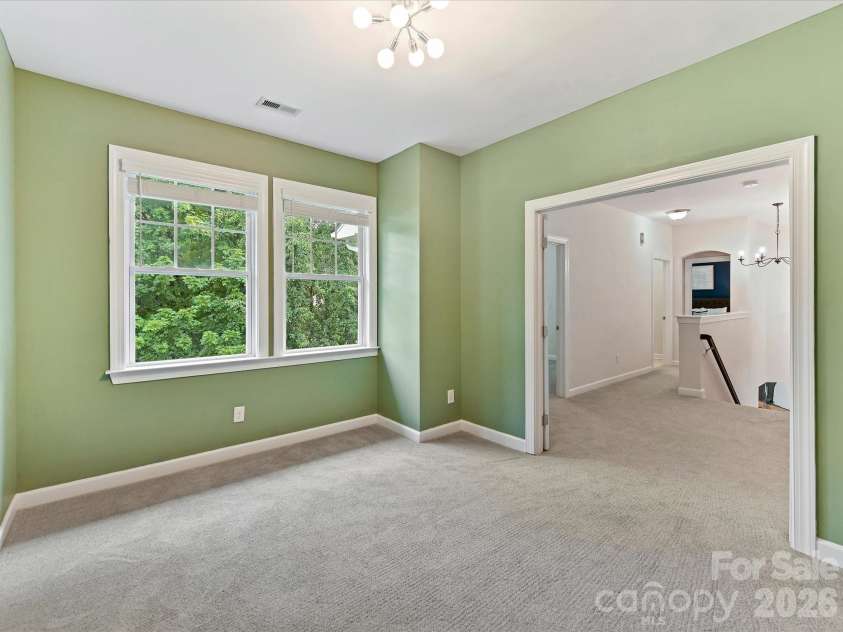 8707 Lake Pines Drive, Cornelius, NC 28031.  MLS# CAR4402781, YatesRealty ID 38115. Versatile flex space with double doors & abundant natural light offers endless possibilities as a playroom, media room, home gym, hobby space, or second living area.