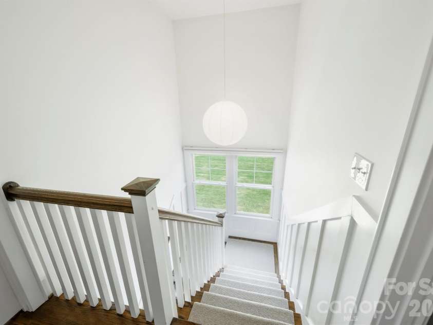 232 Coneflower Place, Fort Mill, SC 29708.  MLS# CAR4401204, YatesRealty ID 38119. Heading upstairs, the new stairway wool runner helps make the pathway safe for everyone.