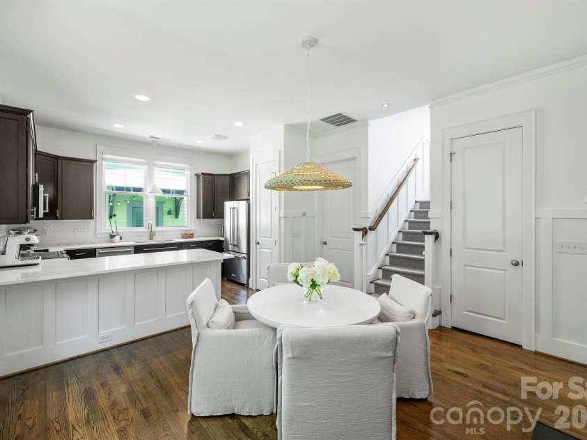 232 Coneflower Place, Fort Mill, SC 29708.  MLS# CAR4401204, YatesRealty ID 38119. The dining area leads into the fabulous kitchen.  Notice the architectural elements which create a sense of elevated style.
