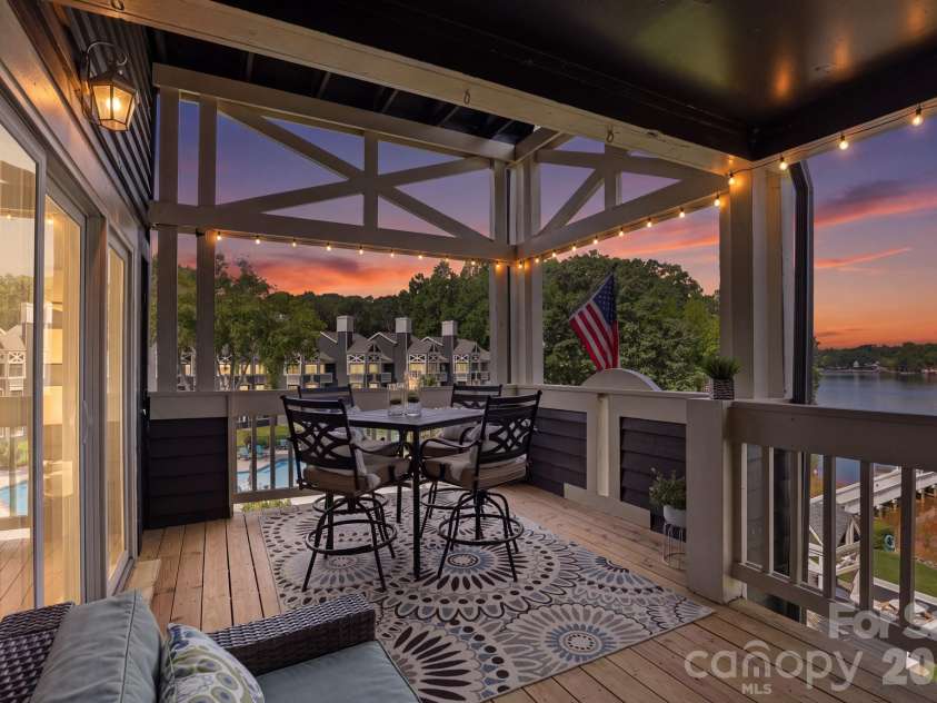 2135 Regatta Lane, Denver, NC 28037.  MLS# CAR4416821, YatesRealty ID 3812. Spacious Balcony overlooks lake -twilight virtual