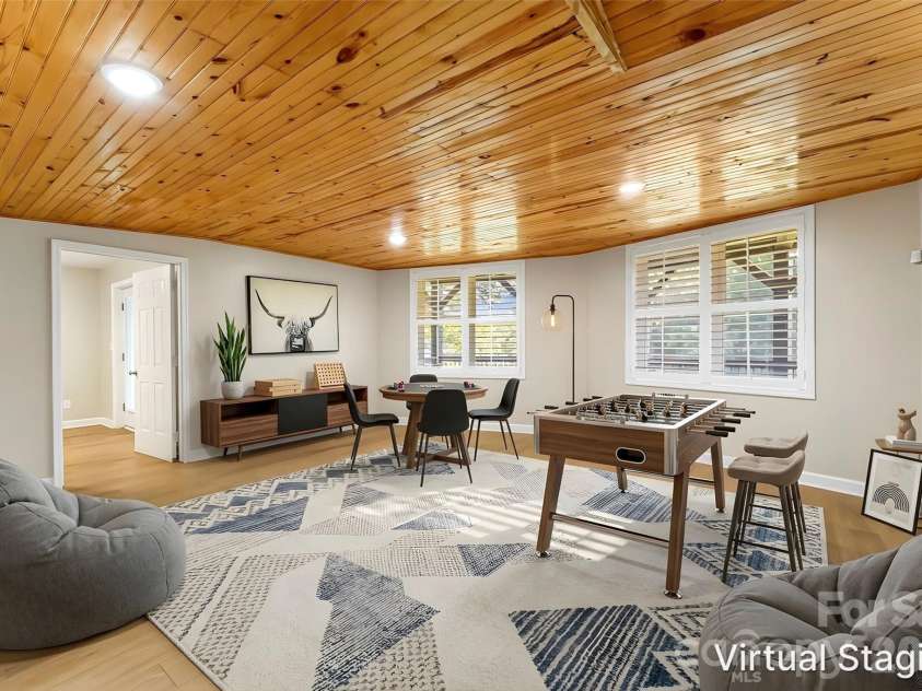 94 Fairway Drive, Nebo, NC 28761.  MLS# CAR4404522, YatesRealty ID 38125. Flex space-virtually staged as game room