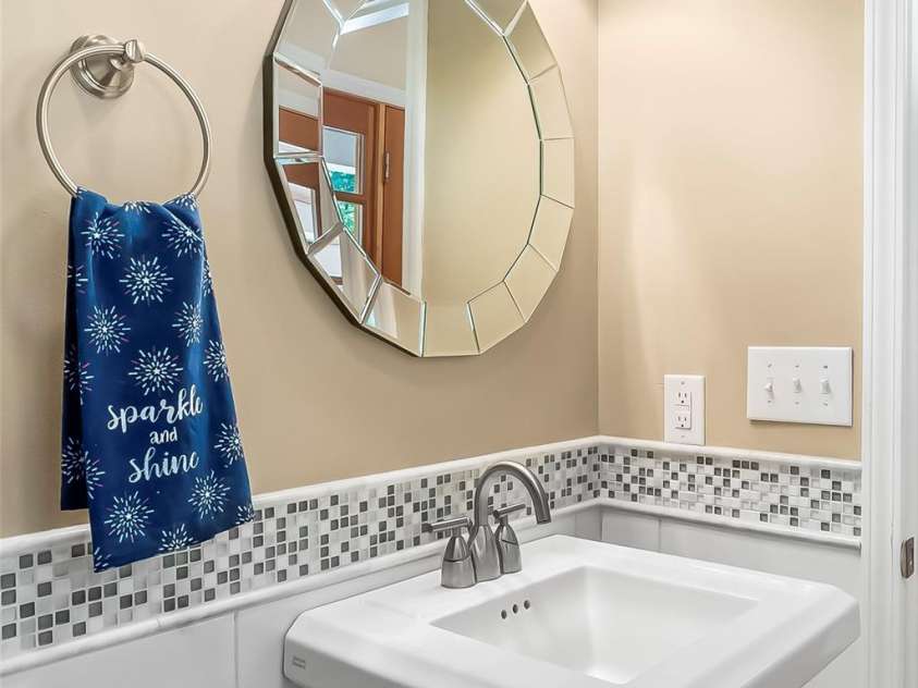 94 Fairway Drive, Nebo, NC 28761.  MLS# CAR4404522, YatesRealty ID 38125. Half bathroom main floor