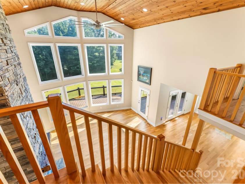 94 Fairway Drive, Nebo, NC 28761.  MLS# CAR4404522, YatesRealty ID 38125. Stairs to loft