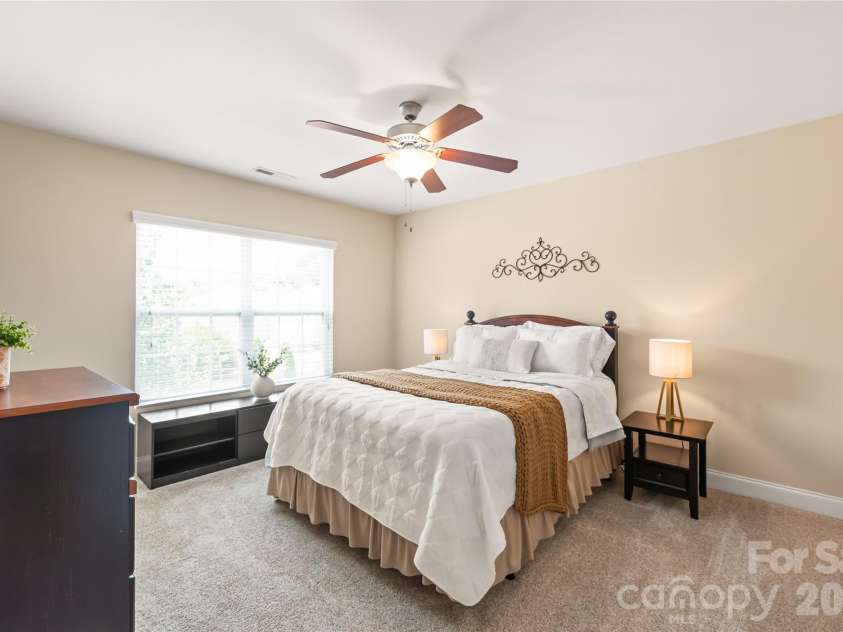 4303 Hampstead Heath Drive, Waxhaw, NC 28173.  MLS# CAR4402437, YatesRealty ID 38129. Bedroom three features a spacious walk-in closet, providing ample storage while keeping the room uncluttered and inviting.