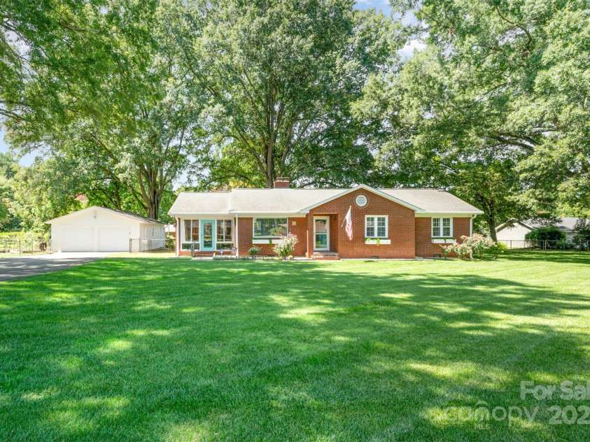4419 Wilgrove Mint Hill Road, Mint Hill, NC 28227.  MLS# CAR4285783, YatesRealty ID 38133. This beautifully maintained brick ranch home offers charm and comfort, featuring a two-car detached garage and a desirable flat, fully fenced backyard, perfectly situated in the sought-after community of Mint 