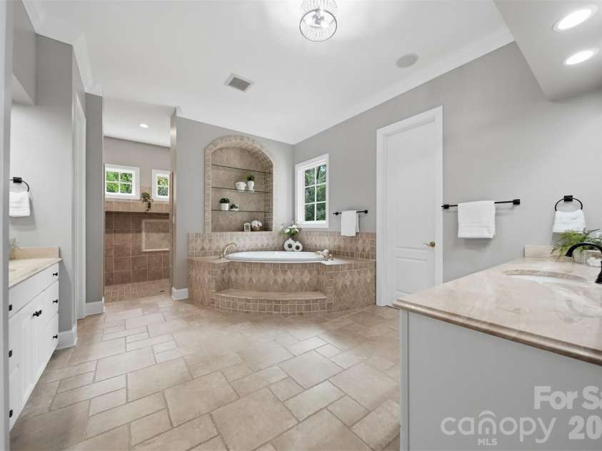 3745 Pinecrest Drive, Hickory, NC 28601.  MLS# CAR4403164, YatesRealty ID 38139. Master Bath on main level - Tile flooring / his/ her sinks, Oversized tile shower w/ dual heads.   Soaking tub...so much to talk about!!