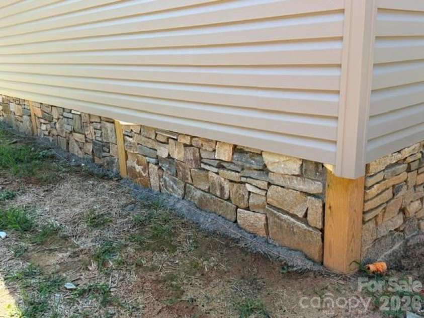 291 McGinnis Way, Old Fort, NC 28762.  MLS# CAR4405208, YatesRealty ID 38149. Rock Work in back
